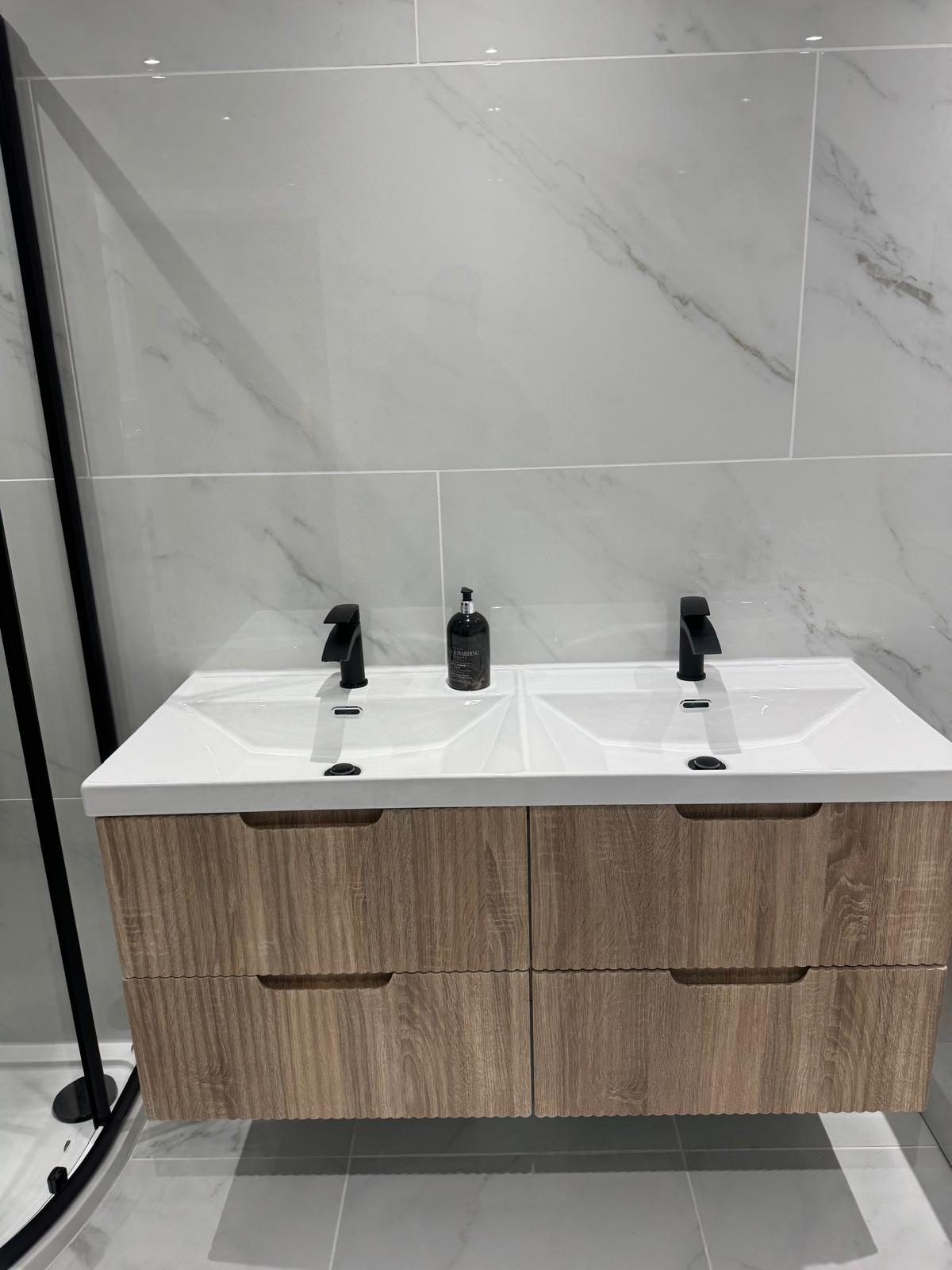 Renovated bathroom with a wall-hung double vanity unit