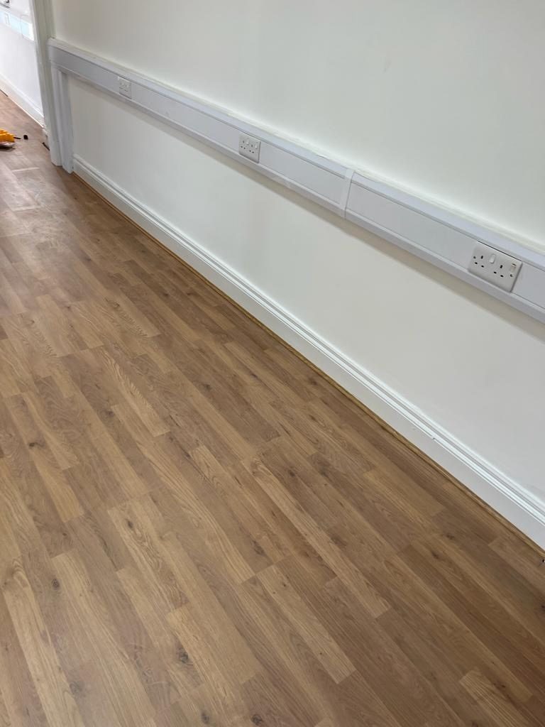 Oak flooring fitted with clean white skirting